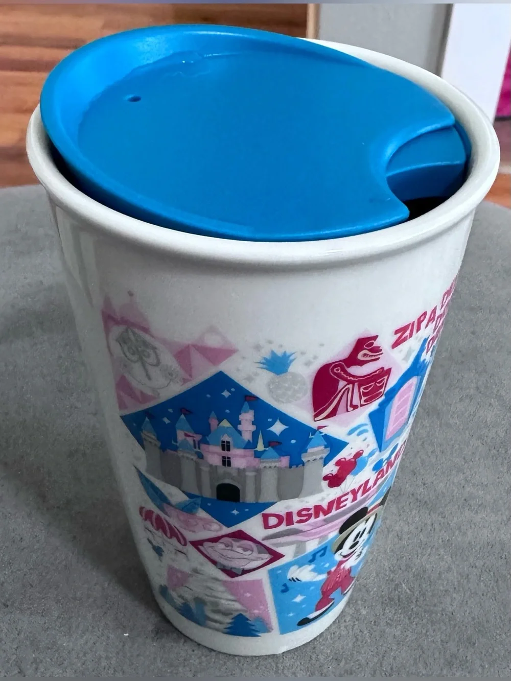 Starbucks Disneyland Travel Mug with Blue Lid and Pink/Blue Graphics